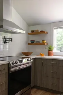 a kitchen with a stove and a cabinets