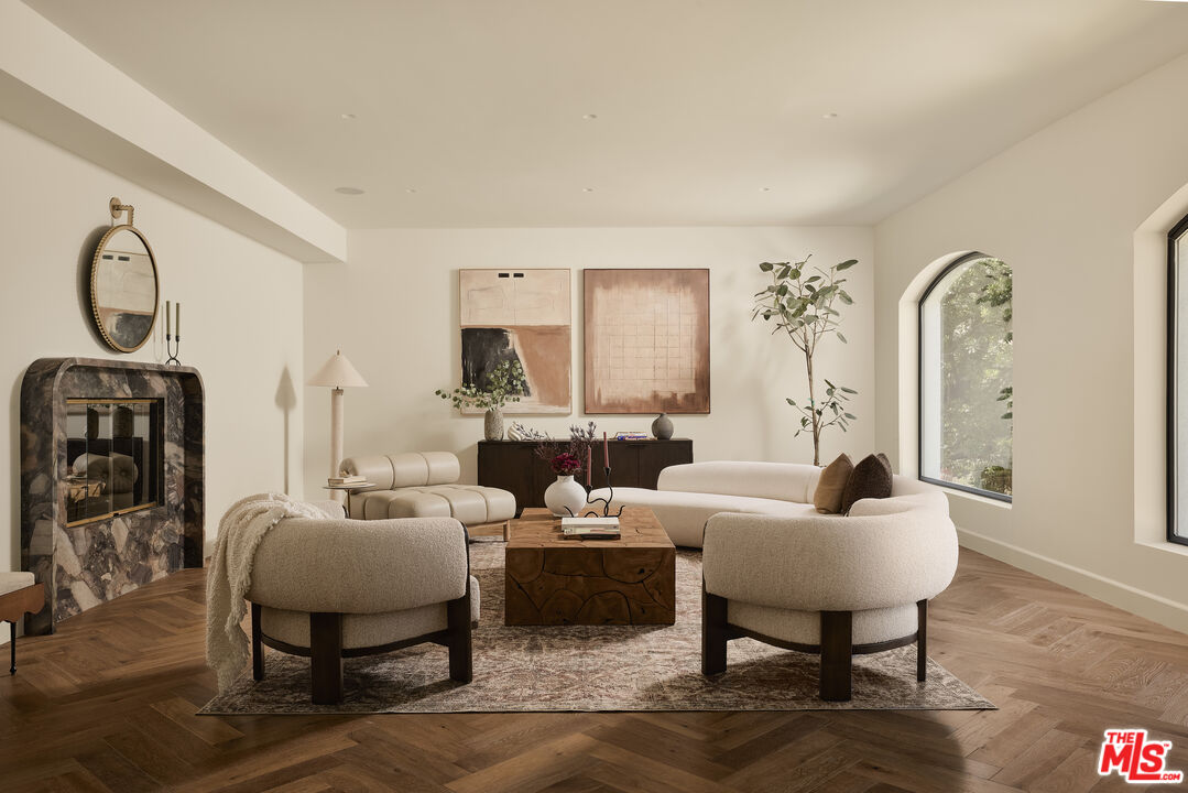 3546 Weslin Avenue Sherman Oaks, CA 91423 - Photo 1 of 2 a living room with furniture a table and wooden floor