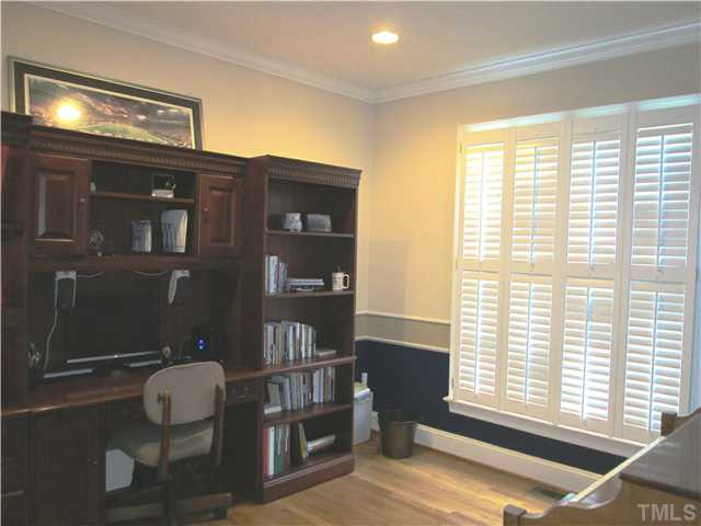9321 Stone Mountain Road Raleigh, NC 27613 - Photo 11 of 25 Formal living room has hardwood floors and plantation shutters! Currently used as an office and piano room. Living Room