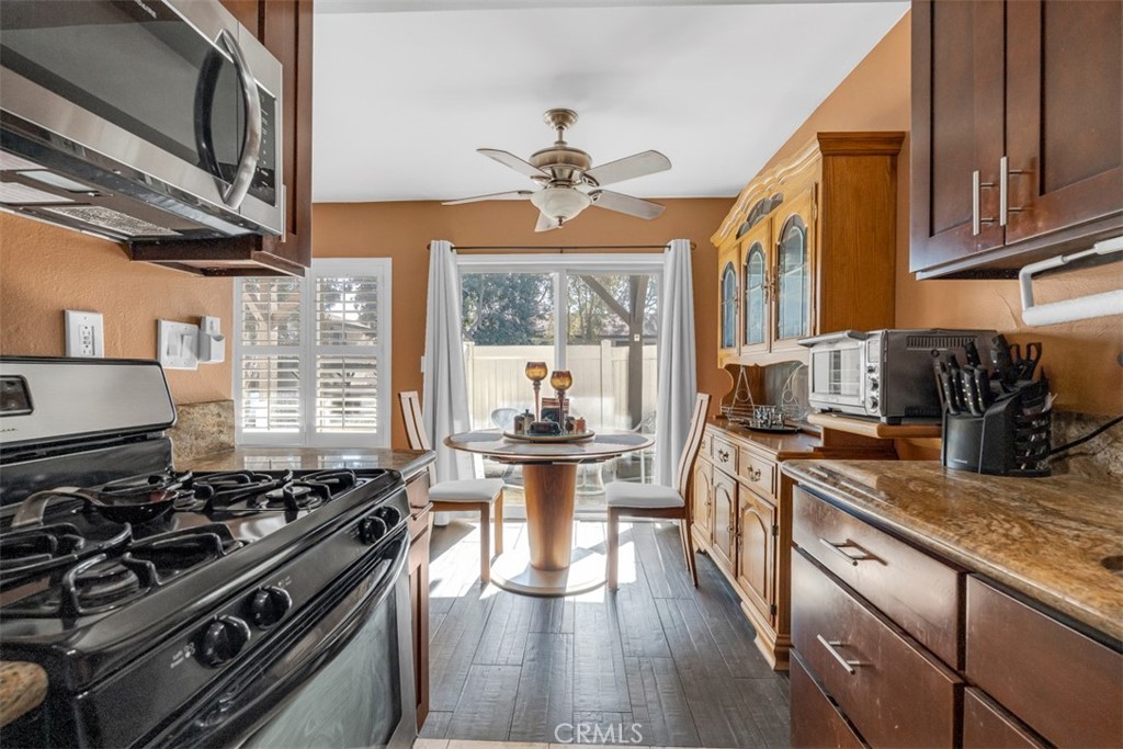 1200 West Lambert Road, Unit 41 La Habra, CA 90631 - Photo 6 of 11 a kitchen with a stove a sink and a refrigerator