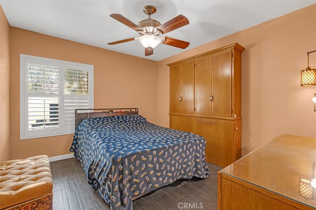 1200 West Lambert Road, Unit 41 La Habra, CA 90631 - Photo 9 of 11 a bedroom with a bed and a chandelier
