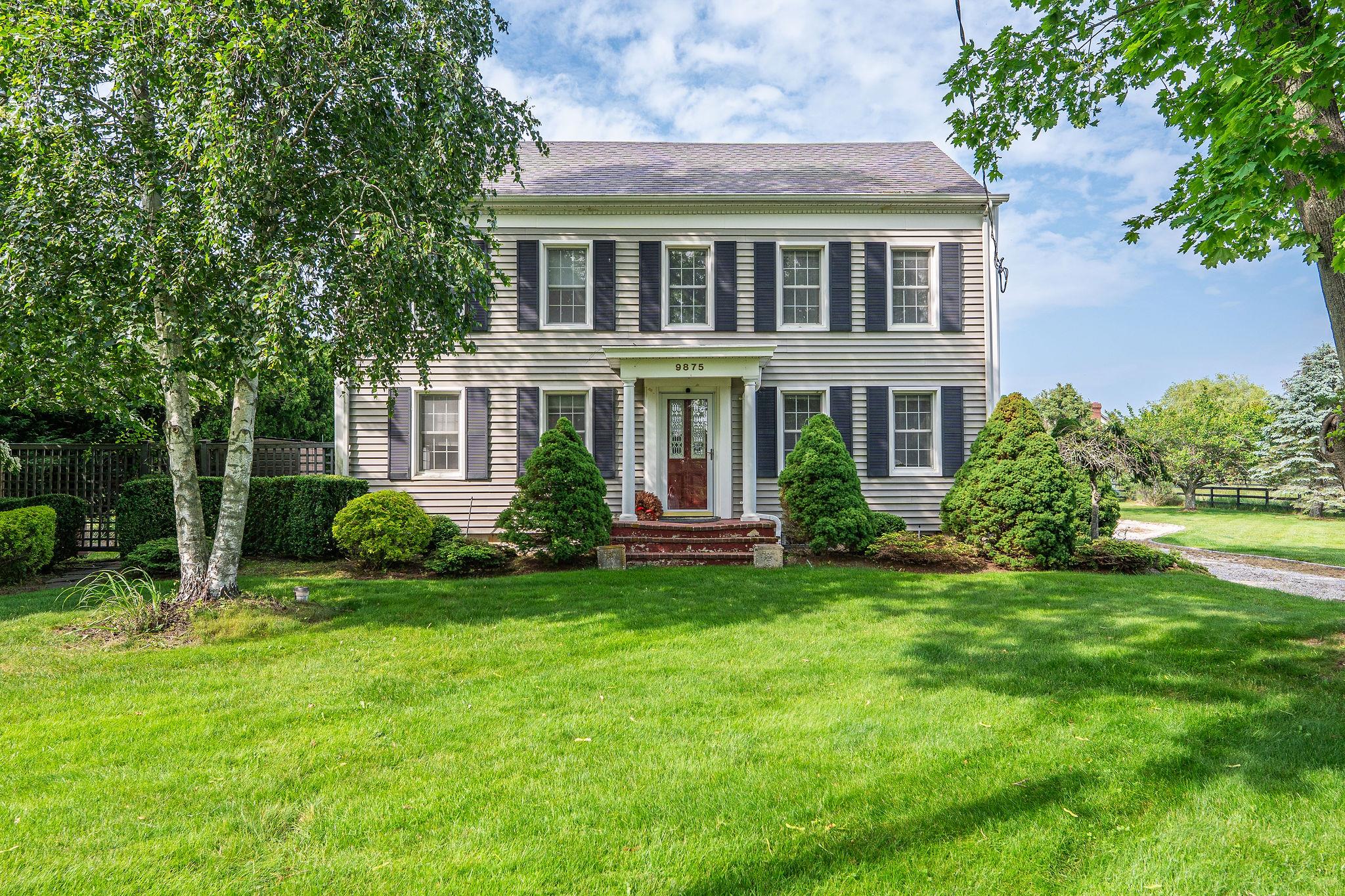 9875 Main Bayview Road Southold, NY 11971 - Photo 1 of 1 Colonial inspired home featuring roof with shingles