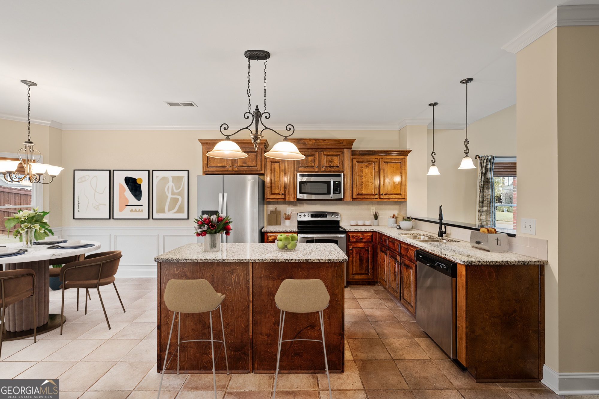 1355 Cold Tree Lane Watkinsville, GA 30677 - Photo 12 of 47 a kitchen with a dining table chairs and white cabinets