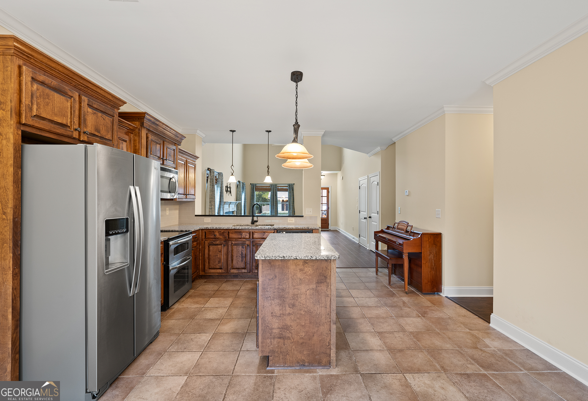 1355 Cold Tree Lane Watkinsville, GA 30677 - Photo 14 of 47 a large kitchen with kitchen island a counter top space appliances and cabinets