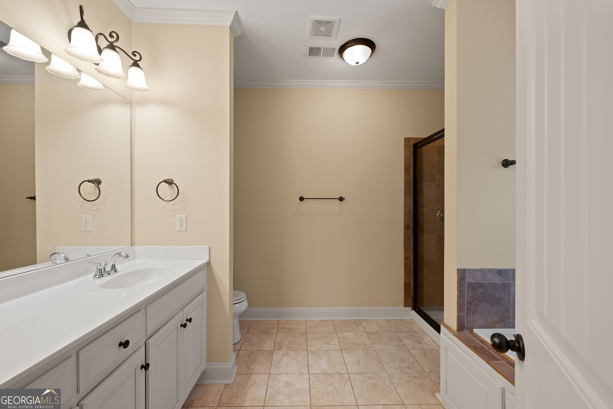 1355 Cold Tree Lane Watkinsville, GA 30677 - Photo 21 of 47 a bathroom with a shower sink and mirror