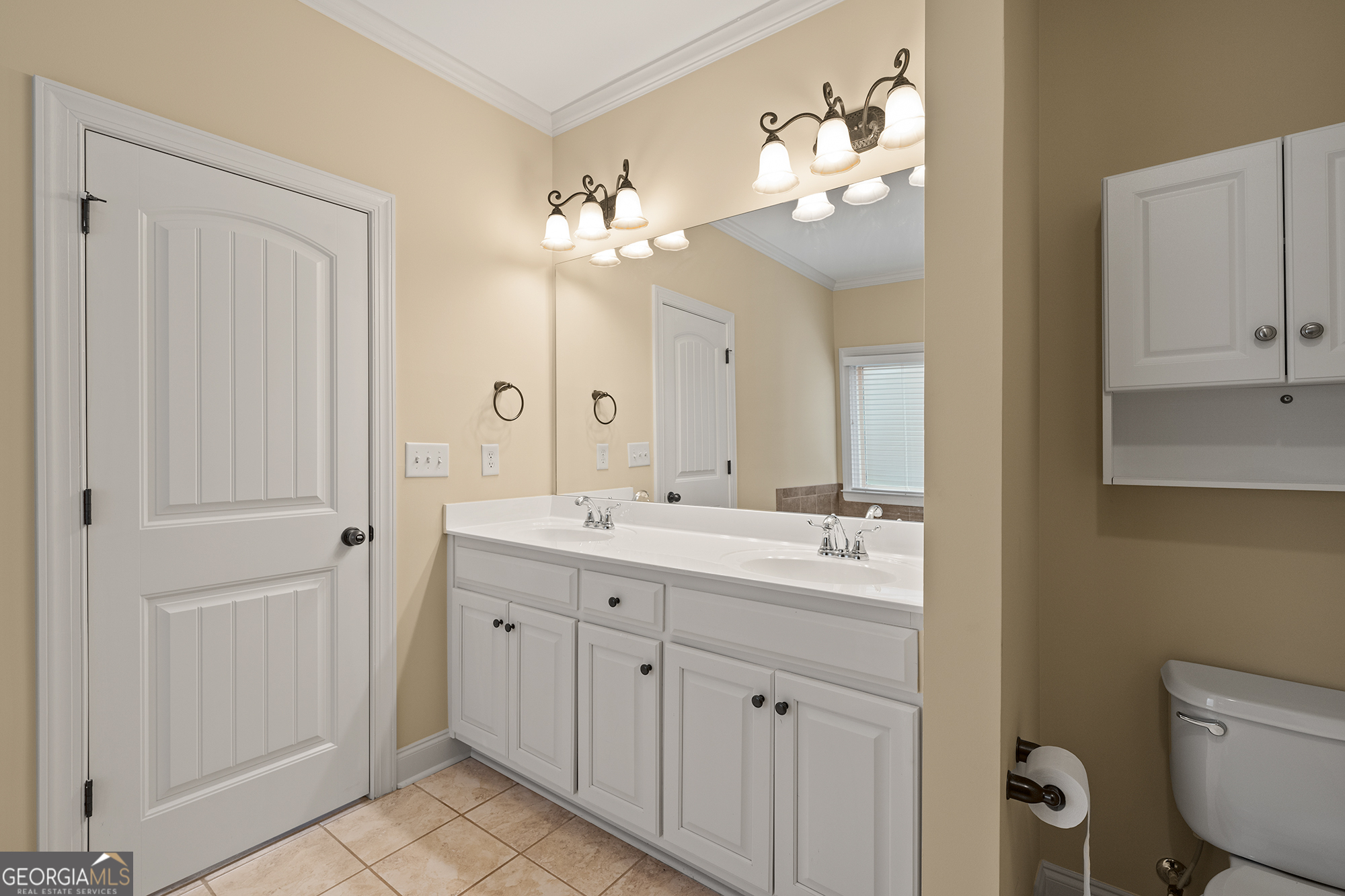 1355 Cold Tree Lane Watkinsville, GA 30677 - Photo 25 of 47 a bathroom with a double vanity sink mirror and toilet