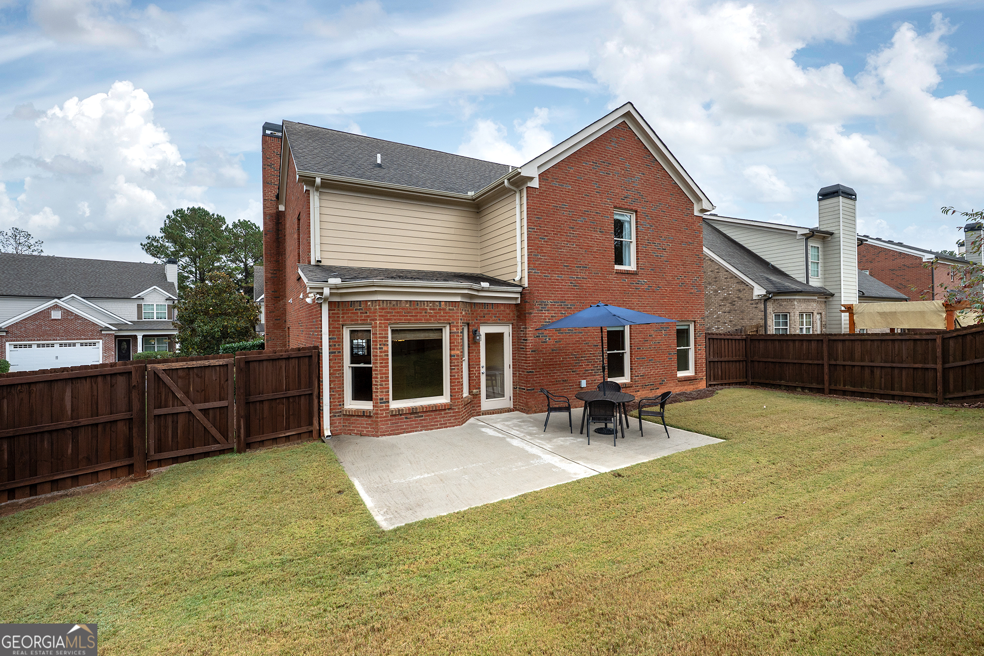 1355 Cold Tree Lane Watkinsville, GA 30677 - Photo 38 of 47 a front view of a house with a yard glass top table and chairs