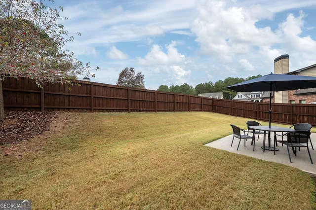 a view of a swimming pool with a seating space