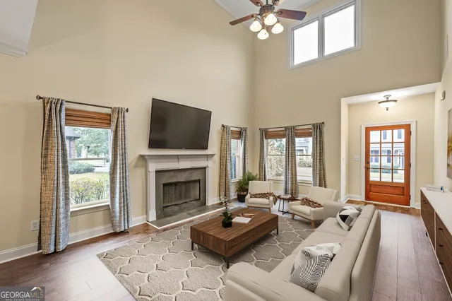 a living room with furniture and a fireplace