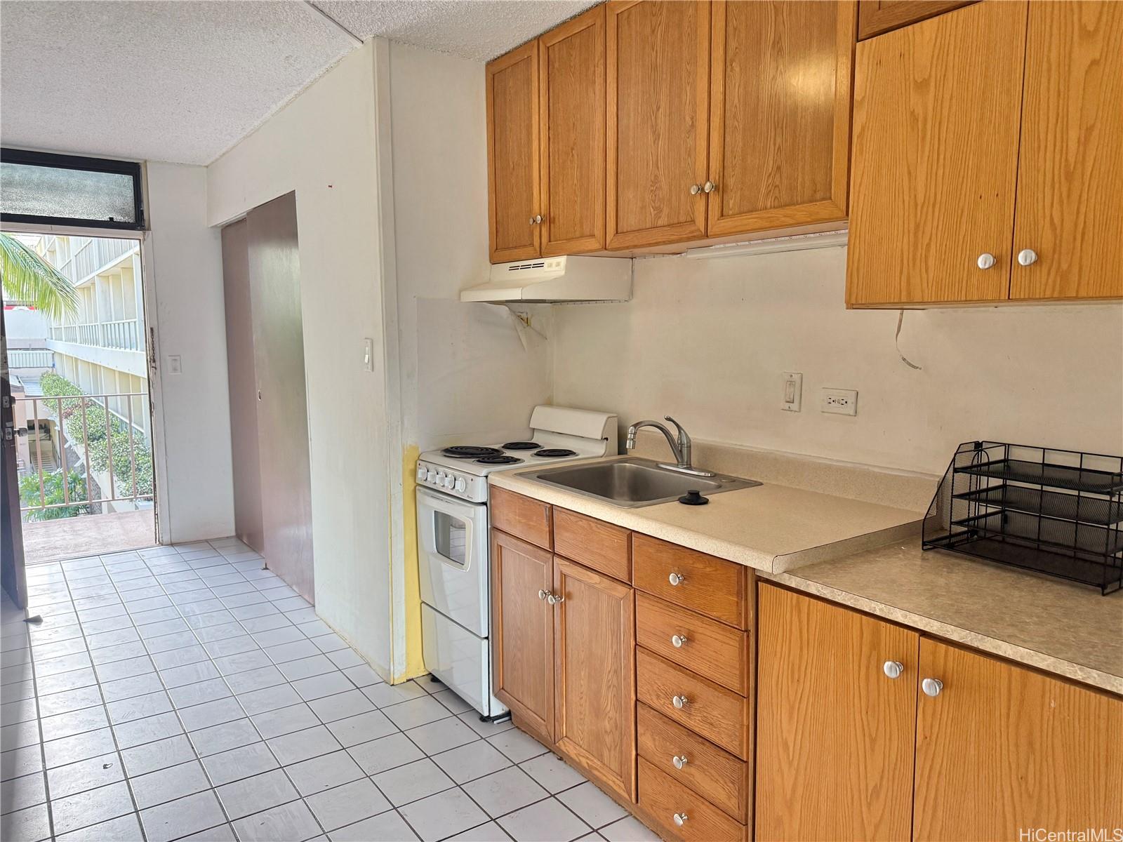 424 Walina Street, Unit 35 Honolulu, HI 96815 - Photo 4 of 15 a kitchen with stainless steel appliances a sink stove and cabinets