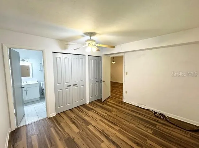 a view of a room with wooden floor