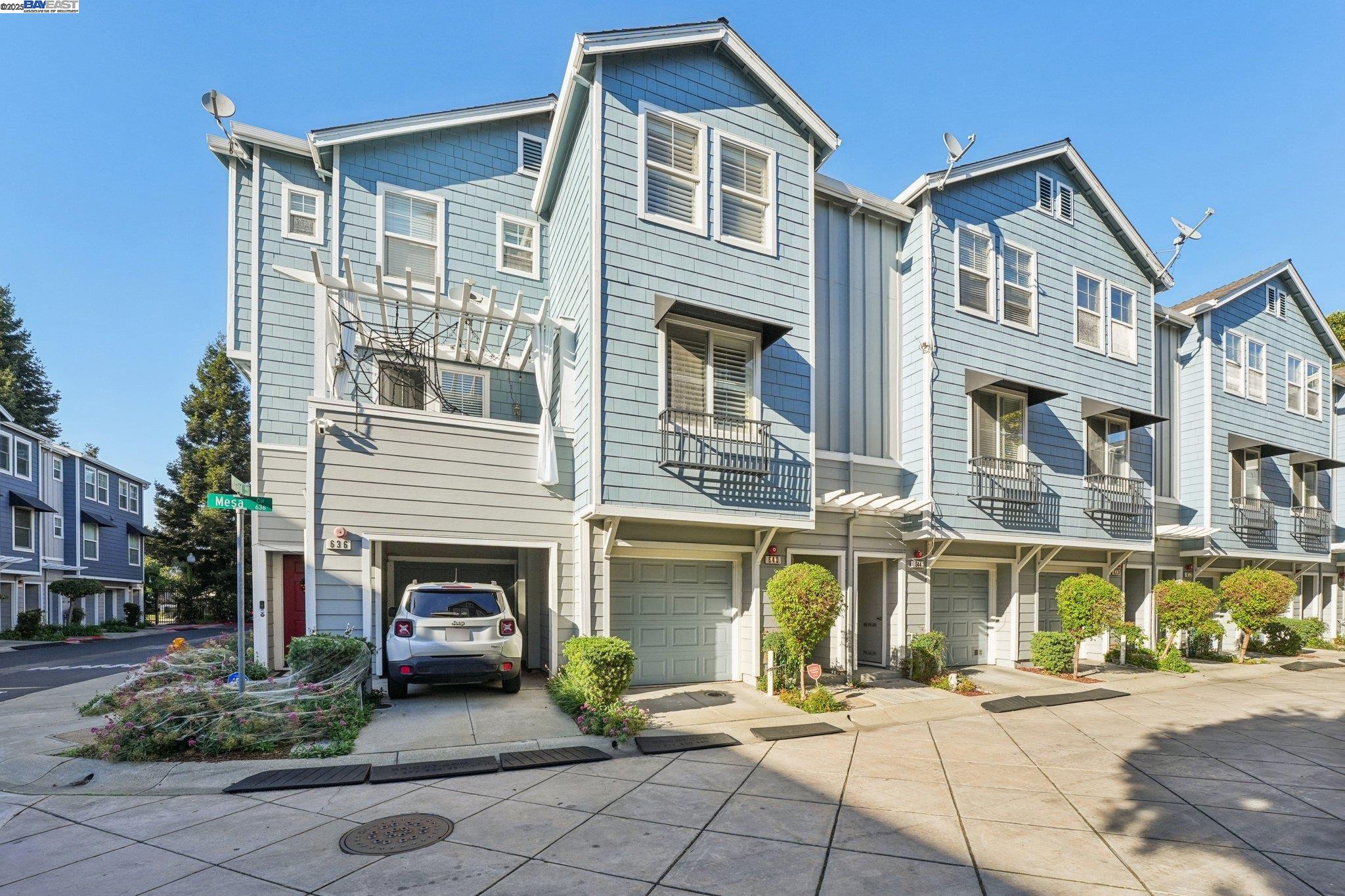 a front view of a residential apartment building with a yard