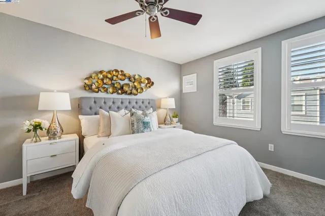 a bedroom with bed and window