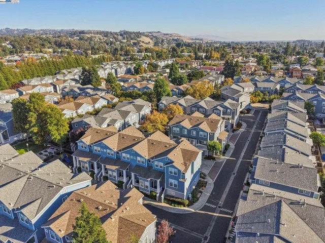an aerial view of a city with lots of residential buildings