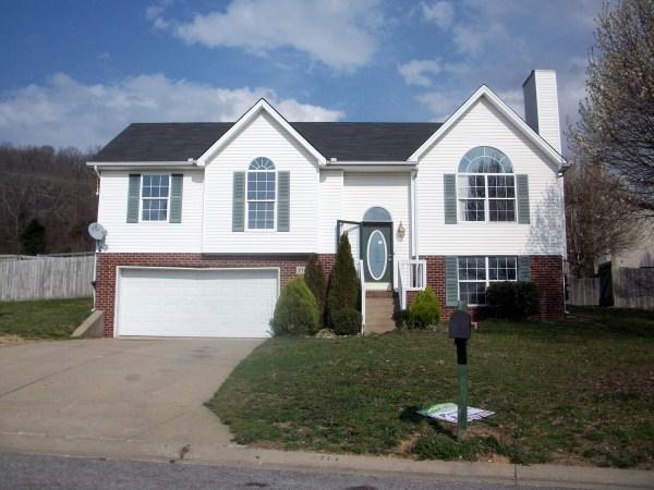 2710 Double Tree Way Spring Hill, TN 37174 - Photo 3 of 17 a front view of a house with a yard and garage