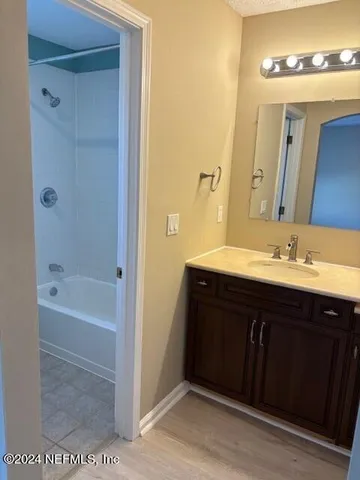 a white toilet sitting next to a bath tub