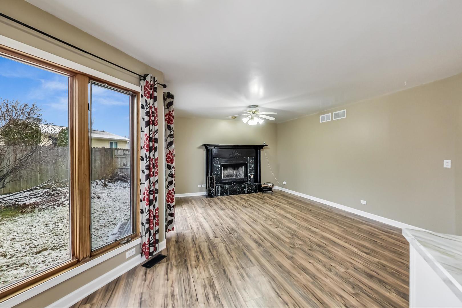 4000 Ridge Road Zion, IL 60099 - Photo 12 of 47 a view of a room with a large window and wooden floor