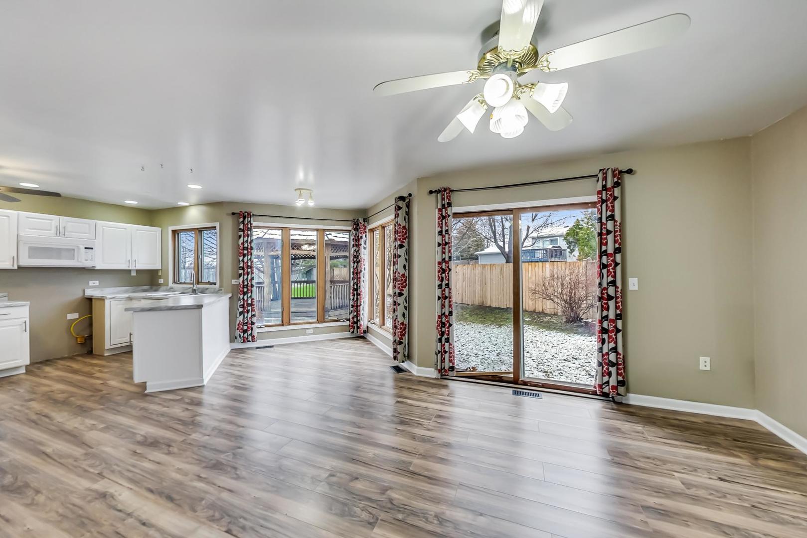 4000 Ridge Road Zion, IL 60099 - Photo 14 of 47 a view of an empty room with window and wooden floor