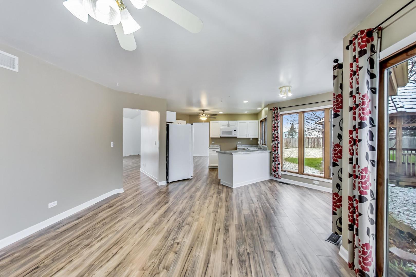 4000 Ridge Road Zion, IL 60099 - Photo 15 of 47 a kitchen with stainless steel appliances granite countertop a refrigerator and microwave