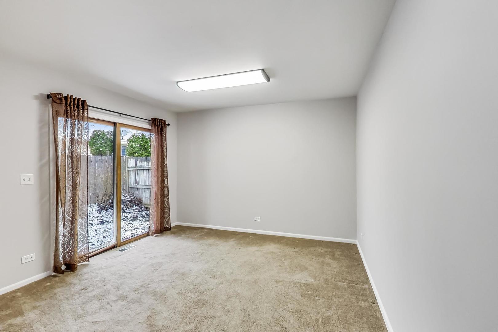 4000 Ridge Road Zion, IL 60099 - Photo 16 of 47 an empty room with sliding door
