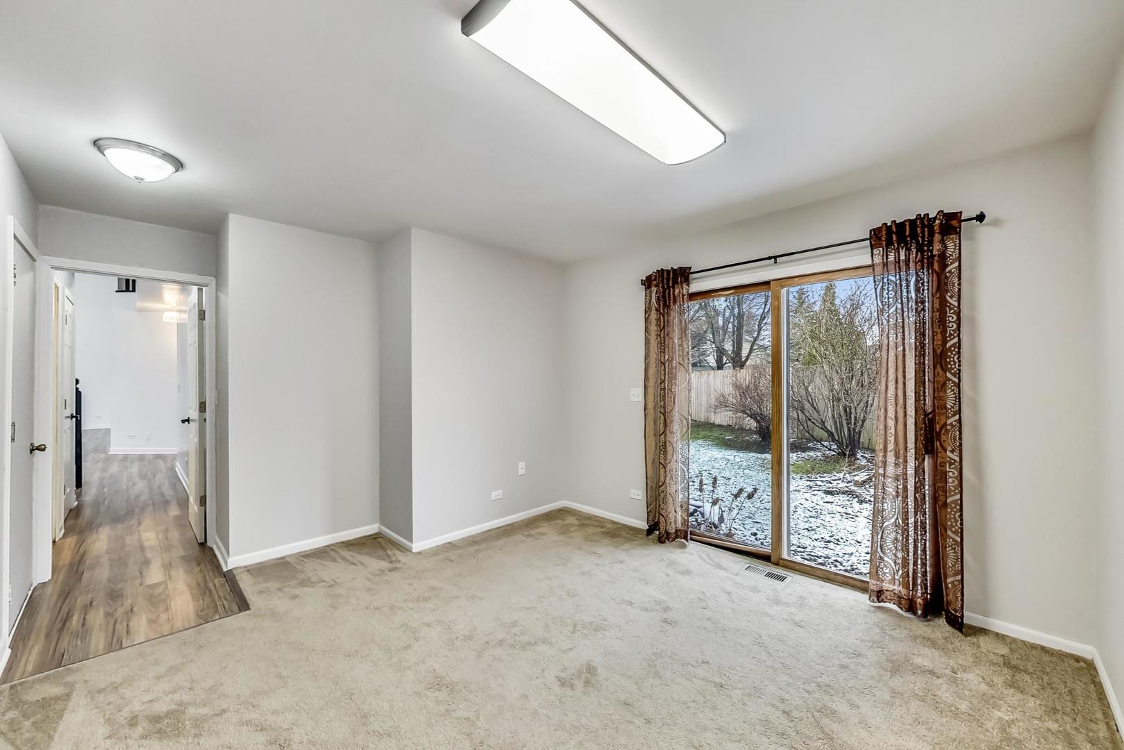 4000 Ridge Road Zion, IL 60099 - Photo 17 of 47 a view of an empty room with sliding glass door