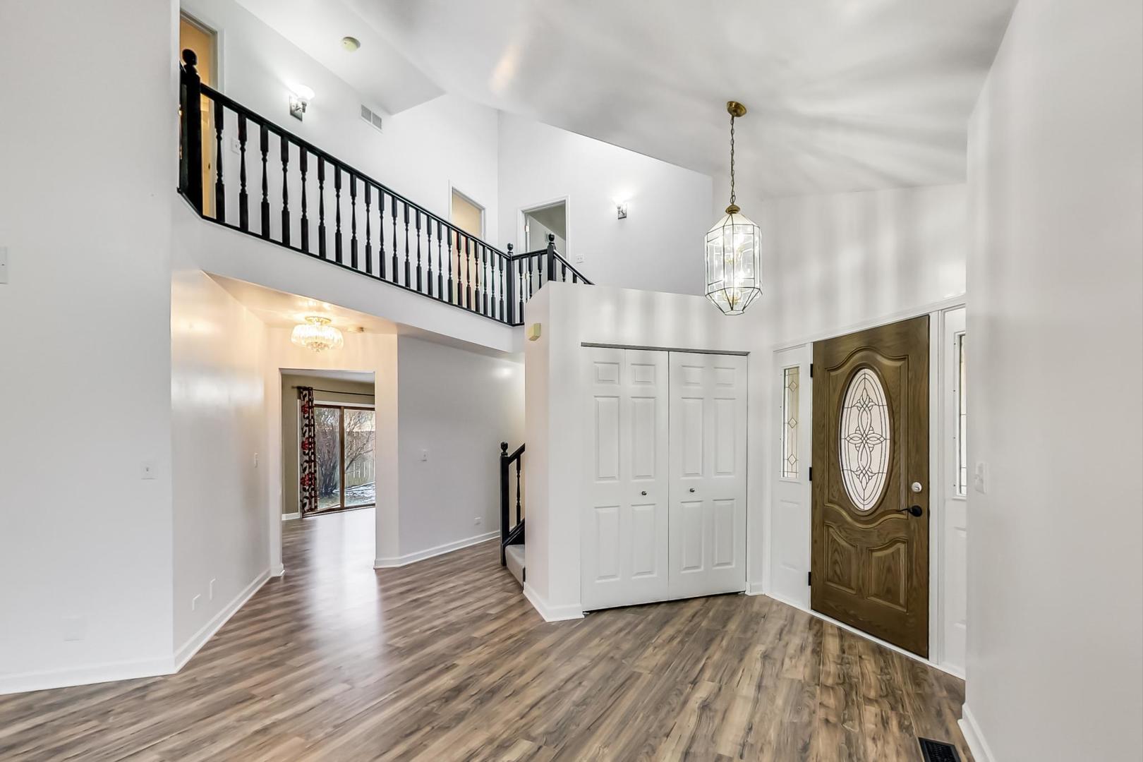 4000 Ridge Road Zion, IL 60099 - Photo 2 of 47 a view of a hallway with wooden floor and entryway