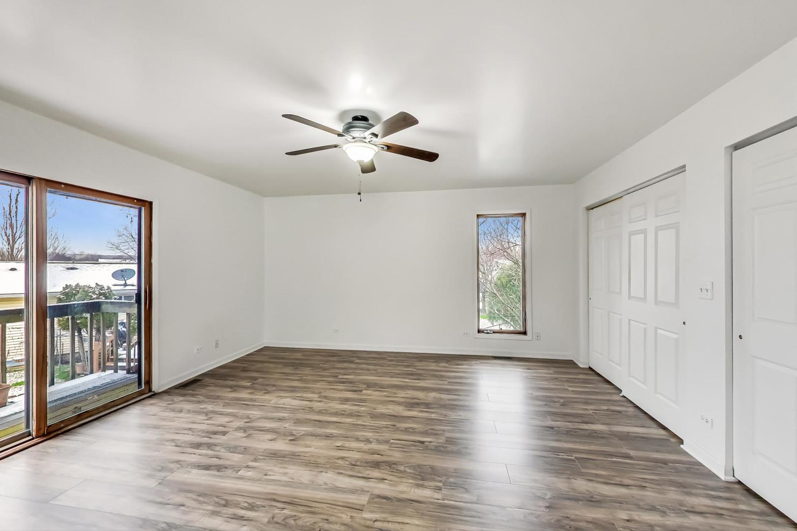 4000 Ridge Road Zion, IL 60099 - Photo 22 of 47 a view of an empty room with a window and wooden floor