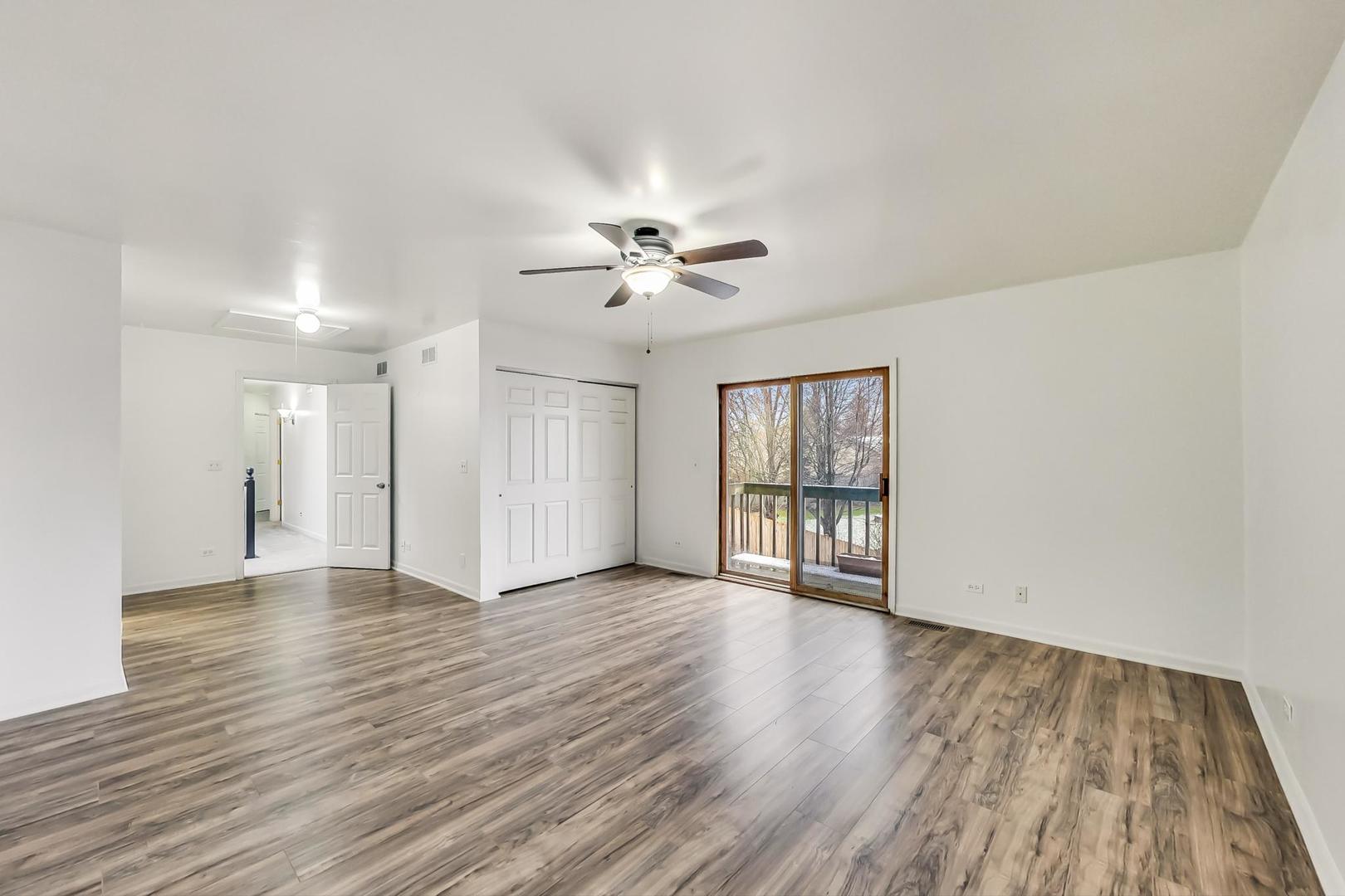 4000 Ridge Road Zion, IL 60099 - Photo 23 of 47 a view of an empty room with window and wooden floor
