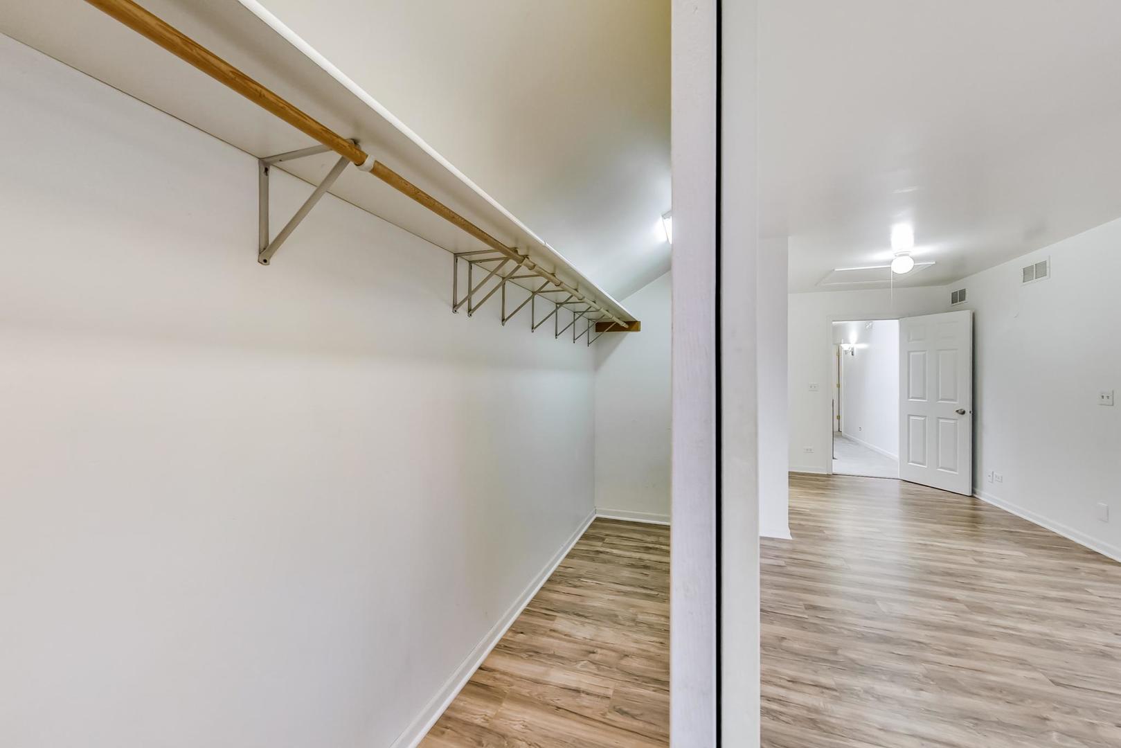 4000 Ridge Road Zion, IL 60099 - Photo 24 of 47 a view of a hallway with wooden floor and staircase