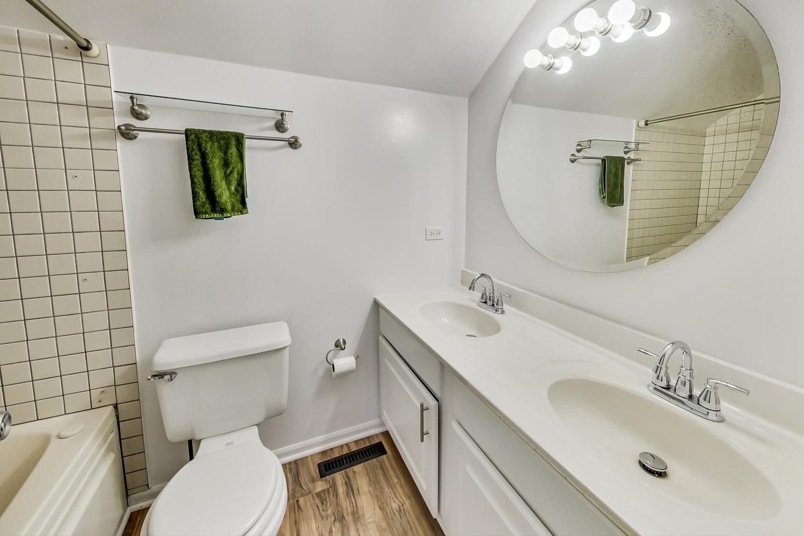 4000 Ridge Road Zion, IL 60099 - Photo 25 of 47 a bathroom with a sink a toilet and mirror