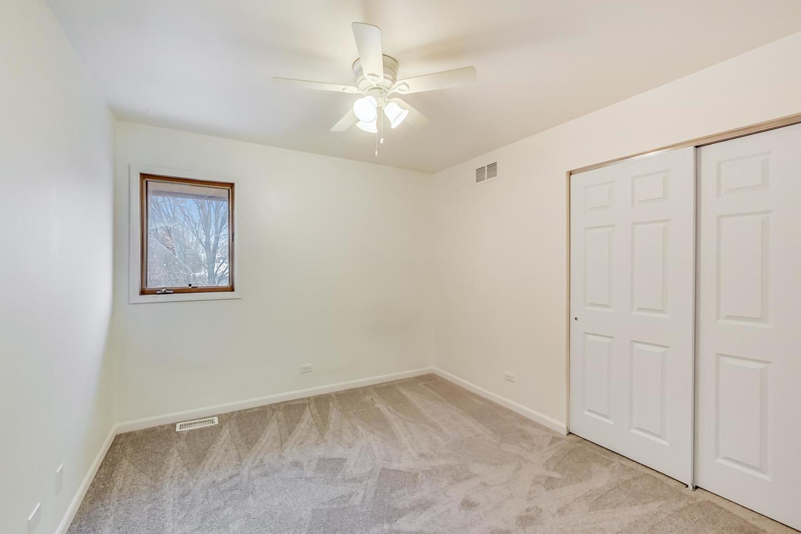 4000 Ridge Road Zion, IL 60099 - Photo 30 of 47 an empty room with a fan & a window