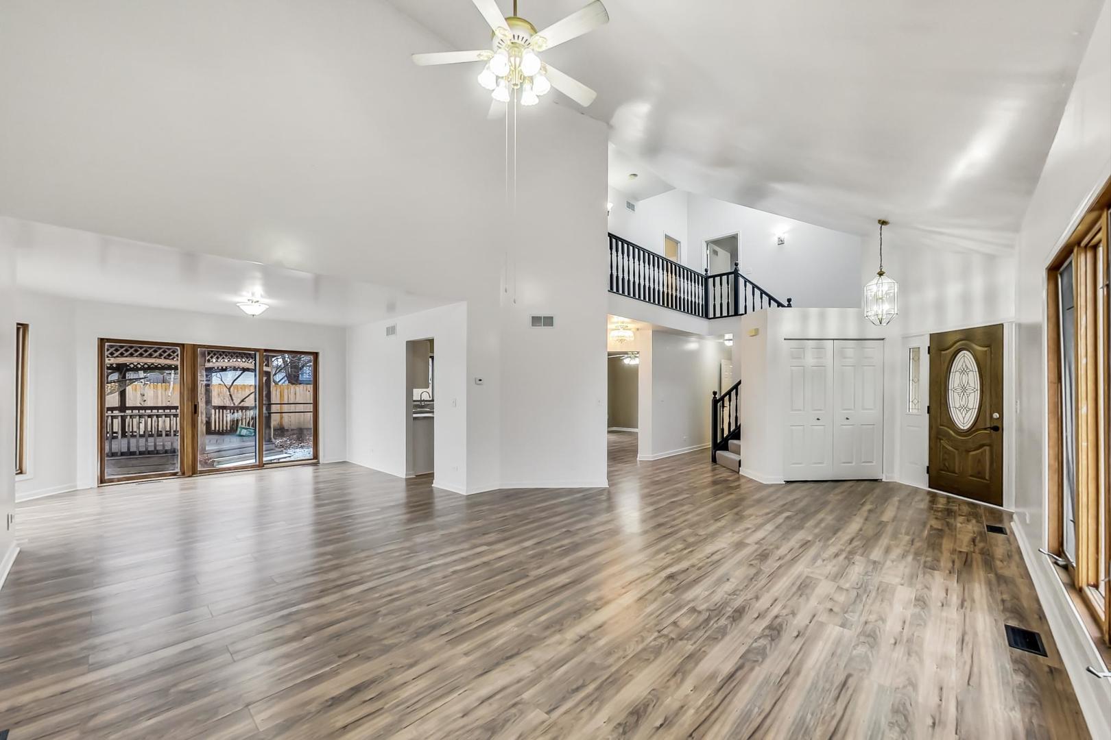 4000 Ridge Road Zion, IL 60099 - Photo 3 of 47 a view of an empty room with window and wooden floor