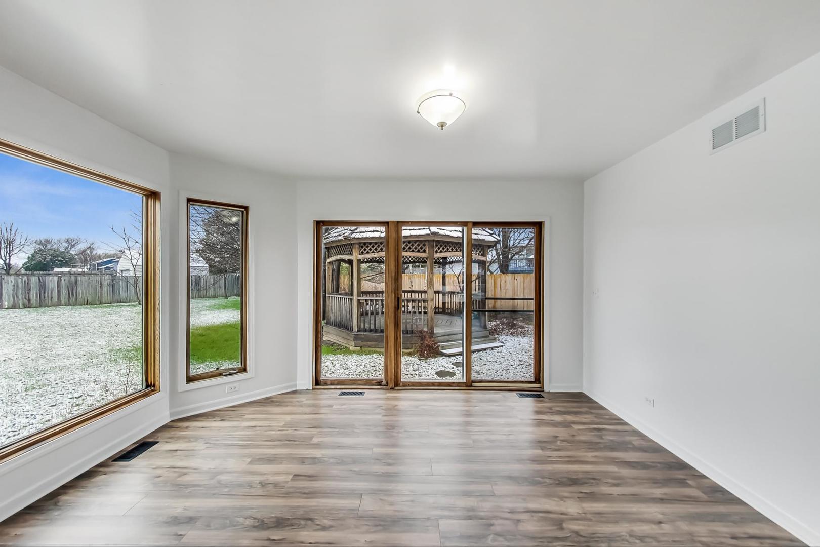 4000 Ridge Road Zion, IL 60099 - Photo 6 of 47 wooden floor in an empty room with a window