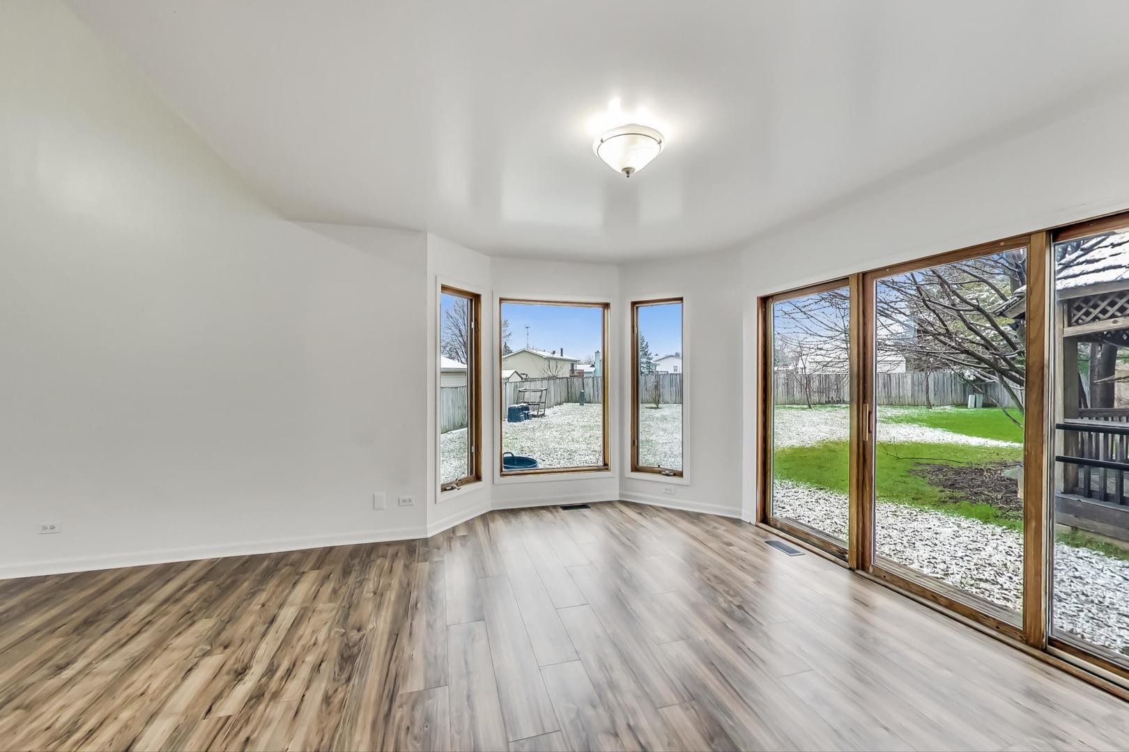 4000 Ridge Road Zion, IL 60099 - Photo 7 of 47 wooden floor in an empty room with a window