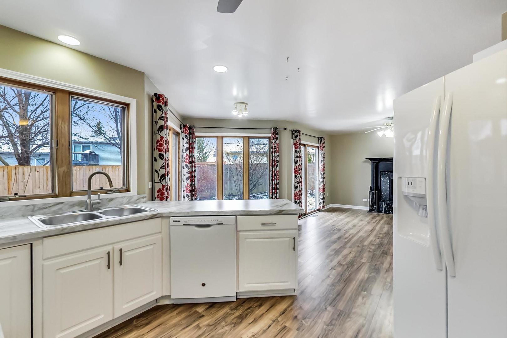 4000 Ridge Road Zion, IL 60099 - Photo 9 of 47 a view of a kitchen with a sink dishwasher stove and cabinets