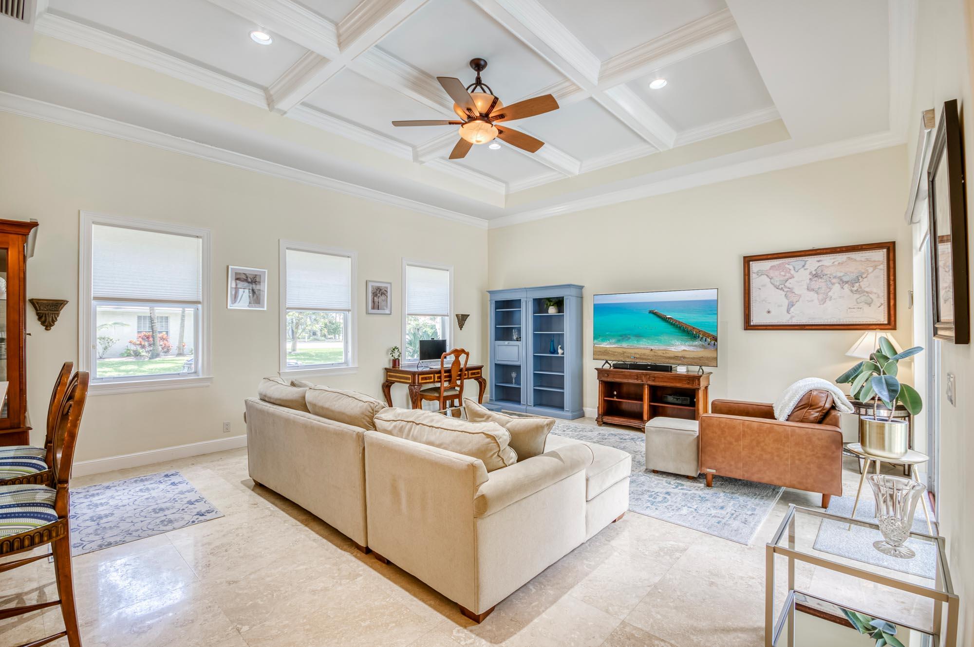 412 Meadowlark Drive Jupiter, FL 33458 - Photo 2 of 40 a living room with furniture kitchen view and a window