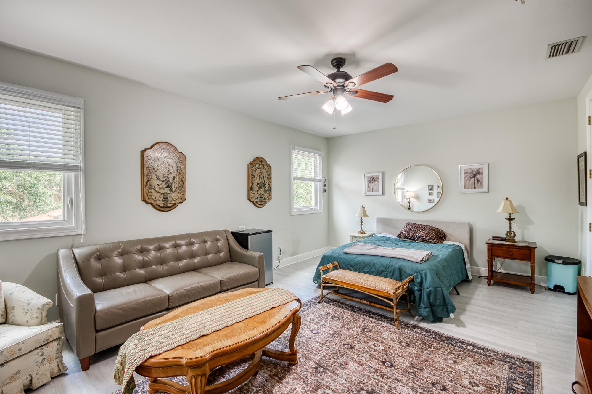 412 Meadowlark Drive Jupiter, FL 33458 - Photo 21 of 40 a living room with furniture a clock and a window