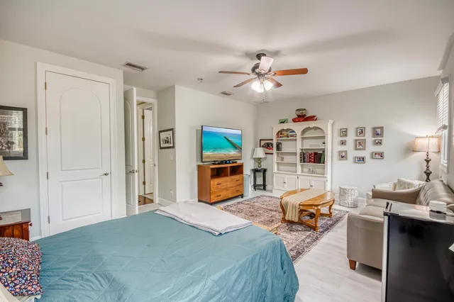 a bedroom with furniture and a fireplace