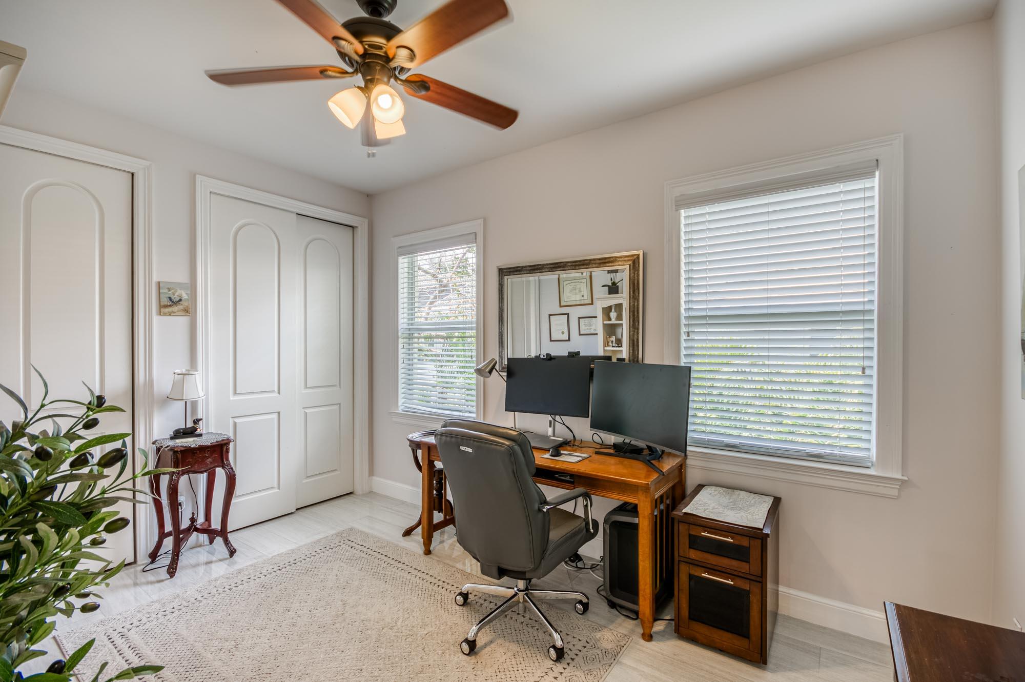 412 Meadowlark Drive Jupiter, FL 33458 - Photo 25 of 40 a workspace with furniture and a window
