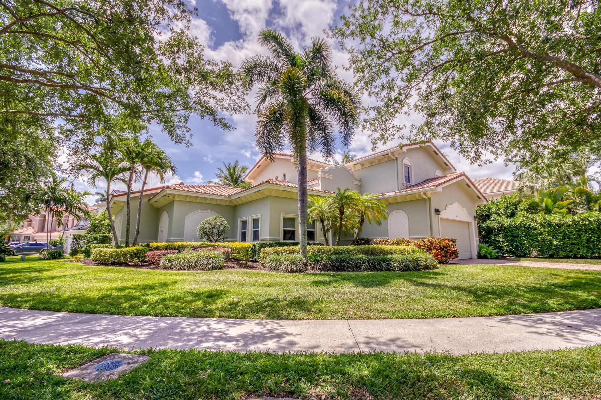 412 Meadowlark Drive Jupiter, FL 33458 - Photo 29 of 40 a front view of a house with a yard and green space