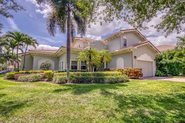 an aerial view of a houses with yard