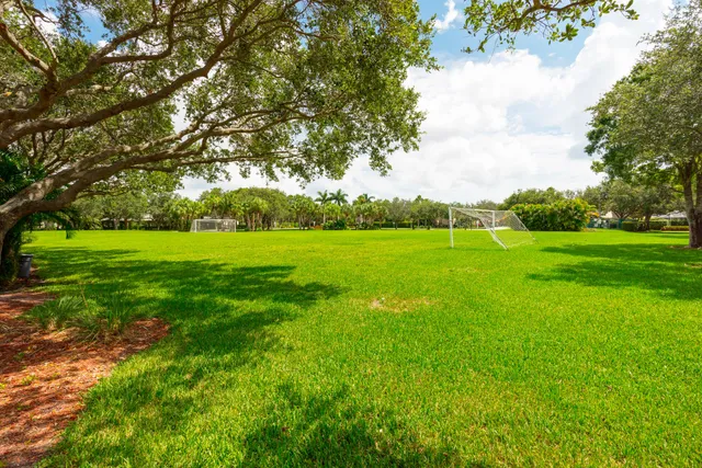 a view of a field with houses