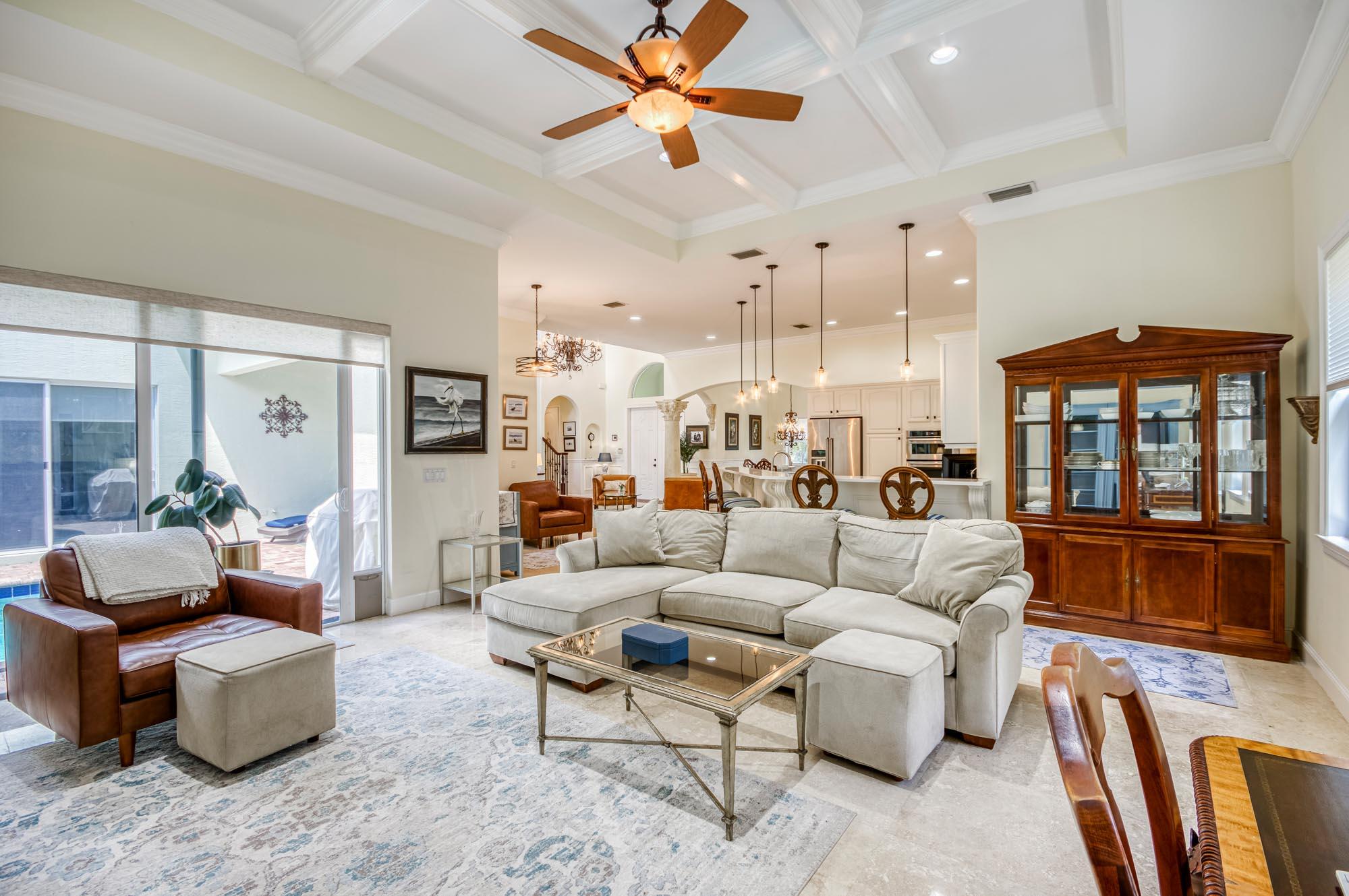 412 Meadowlark Drive Jupiter, FL 33458 - Photo 4 of 40 a living room with furniture a ceiling fan and a window