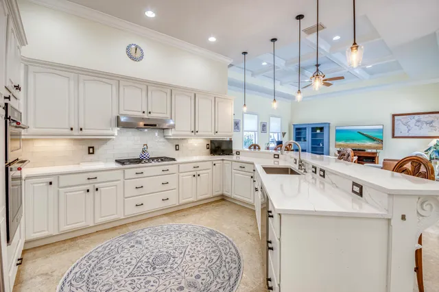 a kitchen with cabinets and window