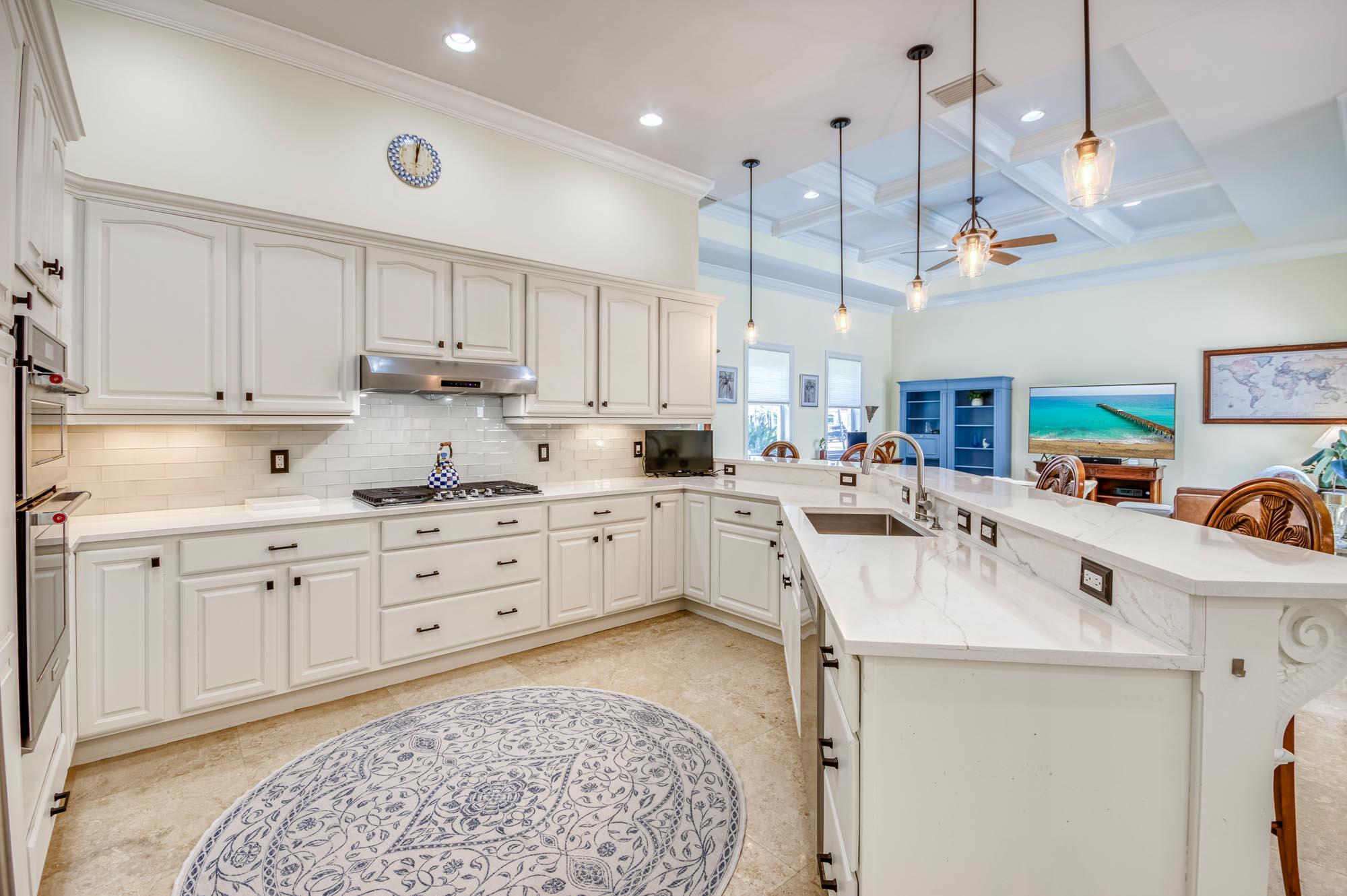 412 Meadowlark Drive Jupiter, FL 33458 - Photo 7 of 40 a kitchen with cabinets and window