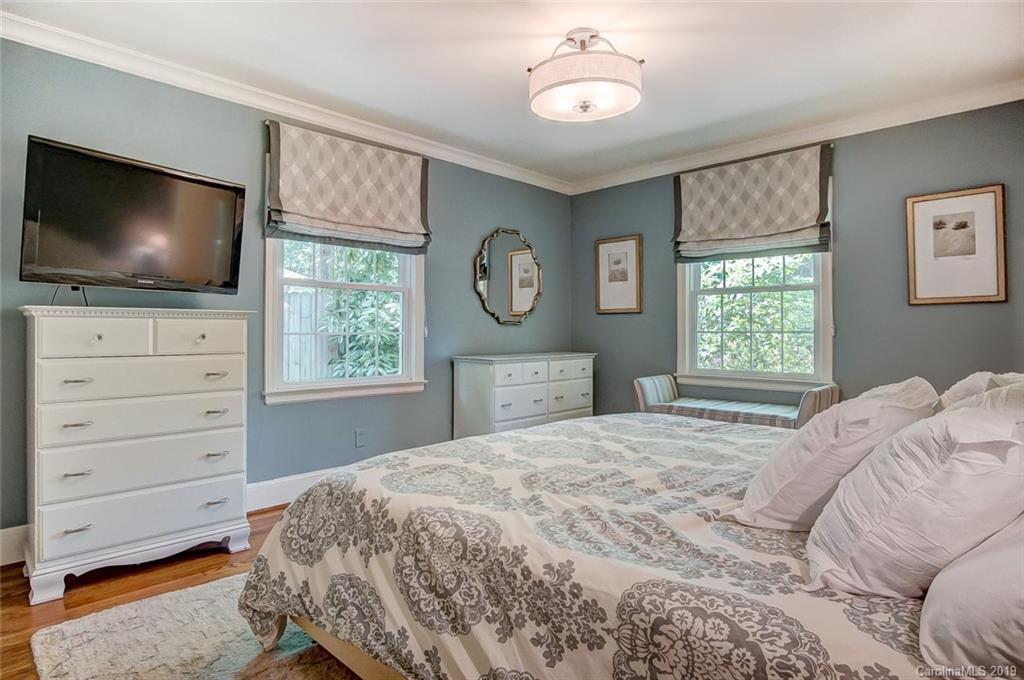 426 Ellsworth Road Charlotte, NC 28211 - Photo 17 of 30 a bedroom with a bed and a flat screen tv