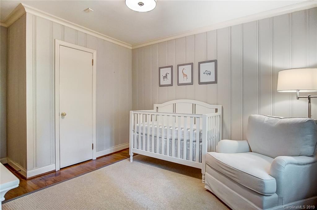 426 Ellsworth Road Charlotte, NC 28211 - Photo 24 of 30 a bedroom with a couch and a lamp on the dresser
