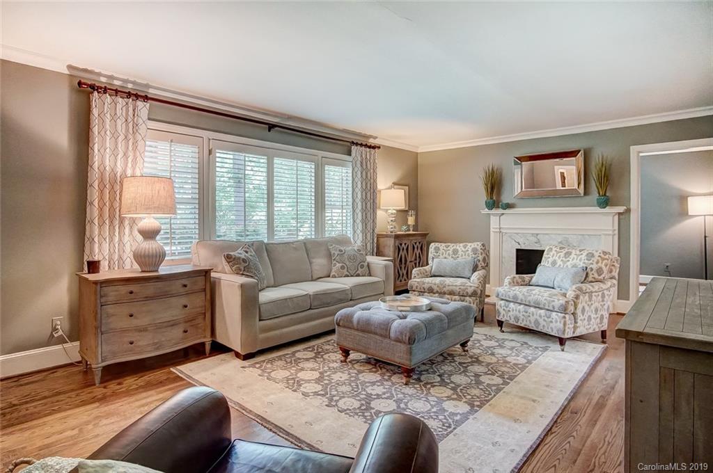 426 Ellsworth Road Charlotte, NC 28211 - Photo 6 of 30 a living room with furniture fireplace and a large window