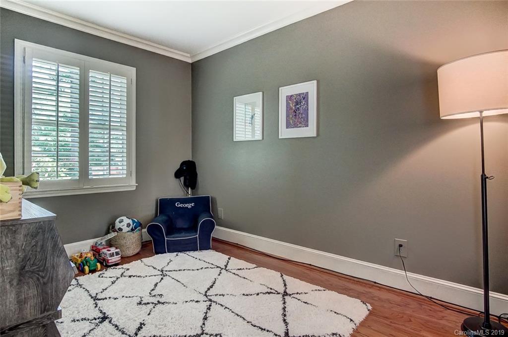 426 Ellsworth Road Charlotte, NC 28211 - Photo 7 of 30 a bedroom with a bed and wooden floor
