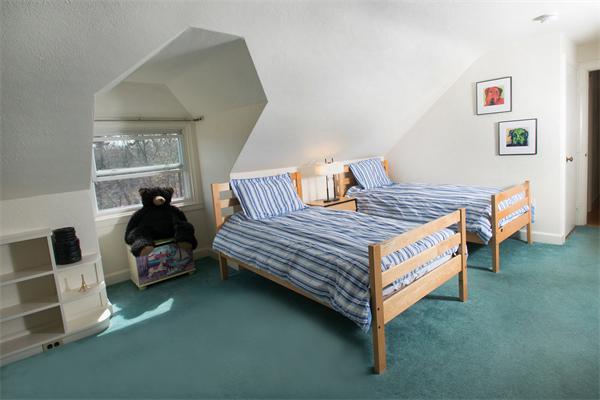 15 West Knoll Road Andover, MA 01810 - Photo 12 of 15 a bedroom with a bed and wooden floor